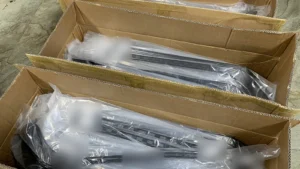 Small batches of hockey sticks individually packed in open cartons